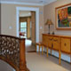 hall with decorative stair railing