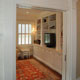 interior view of sitting room with custom built-in entertainment center and bookcases